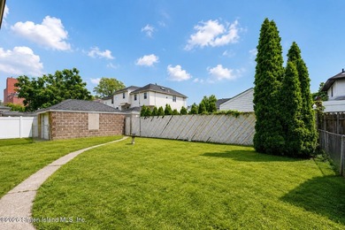 A detached two family home set on an expansive, street to street - photo 6