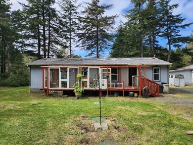 Tucked away among the trees on 1.16 private acres with a Large - photo 1