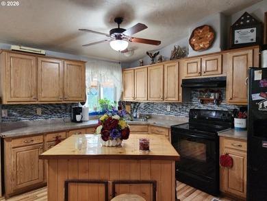 Tucked away among the trees on 1.16 private acres with a Large - photo 5