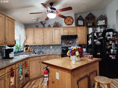 Tucked away among the trees on 1.16 private acres with a Large - photo 7