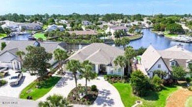 Welcome to waterfront living in the highly sought-after gated - photo 1