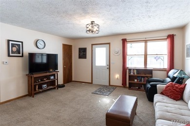 This well-maintained 4-bedroom, 2.5-bath home sits on a spacious