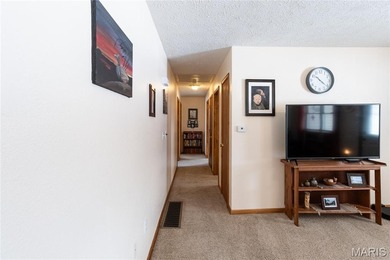 This well-maintained 4-bedroom, 2.5-bath home sits on a spacious