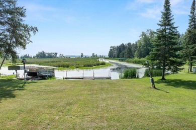 Nestled among mature pines and along a peaceful channel, the - photo 3