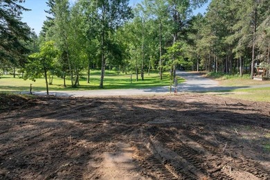 Nestled among mature pines and along a peaceful channel, the - photo 5