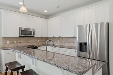 This one level living cottage enjoys peaceful pond views in the - photo 12