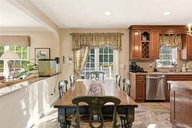FLOWER HILL, ROSLYN | BRICK CENTER HALL COLONIAL. Located on a - photo 13