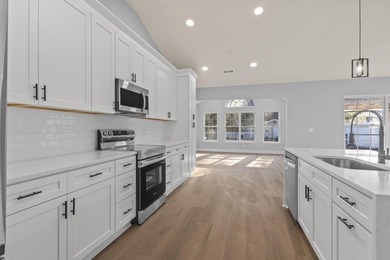 Welcome to this beautifully fully renovated 3 bedrooms, 2 and a - photo 8