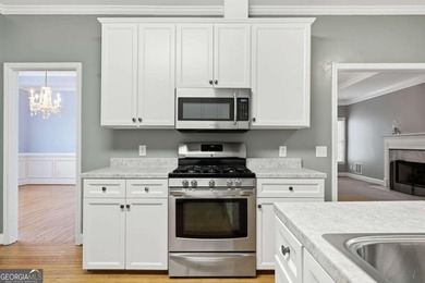 Fantastic Opportunity! This ranch home sits on just under half