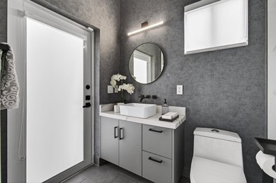 Don't miss this exceptional three-story townhome, masterfully - photo 26