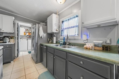 Welcome to 6043 East West Way, an inviting coastal home nestled - photo 4