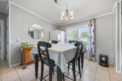 Welcome to 6043 East West Way, an inviting coastal home nestled - photo 5