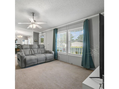 Welcome to 6043 East West Way, an inviting coastal home nestled - photo 6