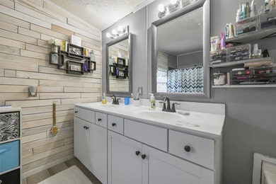 Welcome to 6043 East West Way, an inviting coastal home nestled - photo 8