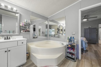 Welcome to 6043 East West Way, an inviting coastal home nestled - photo 9