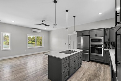 Brand new construction on the beautiful Cheboygan River! Enjoy - photo 13