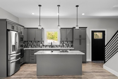 Brand new construction on the beautiful Cheboygan River! Enjoy - photo 14