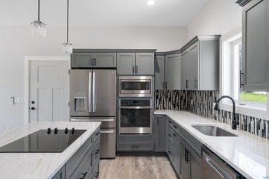 Brand new construction on the beautiful Cheboygan River! Enjoy - photo 15