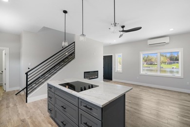 Brand new construction on the beautiful Cheboygan River! Enjoy - photo 20