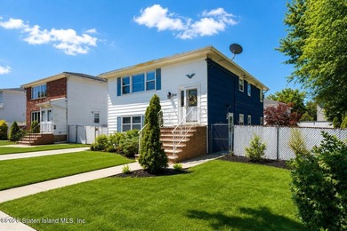 THIS TWO FAMILY HI-RANCH OFFERS A 3 BEDROOM MASTER PLUS A ONE - photo 1
