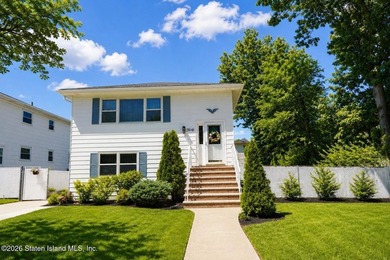 THIS TWO FAMILY HI-RANCH OFFERS A 3 BEDROOM MASTER PLUS A ONE - photo 2