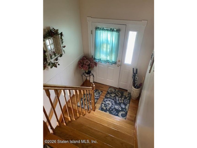 THIS TWO FAMILY HI-RANCH OFFERS A 3 BEDROOM MASTER PLUS A ONE - photo 3