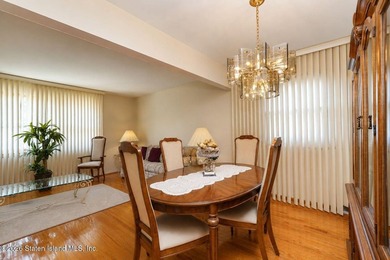 THIS TWO FAMILY HI-RANCH OFFERS A 3 BEDROOM MASTER PLUS A ONE - photo 6