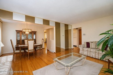 THIS TWO FAMILY HI-RANCH OFFERS A 3 BEDROOM MASTER PLUS A ONE - photo 9