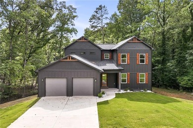 Welcome to lakeside living on Lake Lanier in the sought-after - photo 1