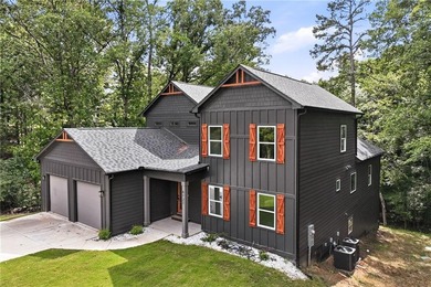 Welcome to lakeside living on Lake Lanier in the sought-after - photo 2