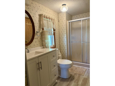 Meticulously maintained manufactured home on the shores of - photo 12