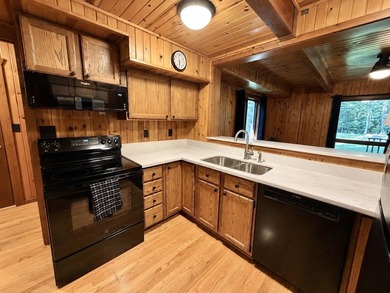 Nestled on a beautifully wooded lot in the gated community of - photo 3