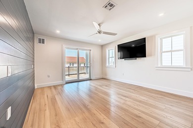 Located just a short walk from the shoreline, this newly