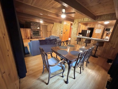 Nestled on a beautifully wooded lot in the gated community of - photo 9
