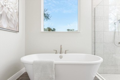 Former Model Home - Situated in Elegant Manor Estates, you will - photo 21