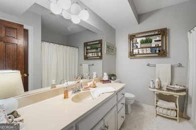 Welcome to this stunning four-sided brick lakefront retreat - photo 27