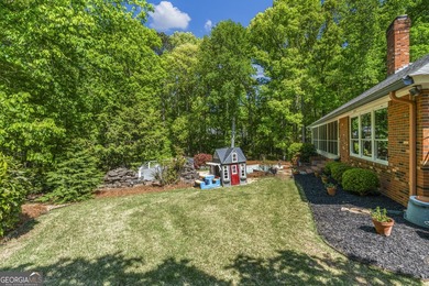 Welcome to this stunning four-sided brick lakefront retreat - photo 33