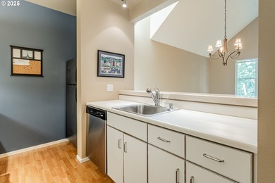 Perched on the top floor of a well-maintained building, this