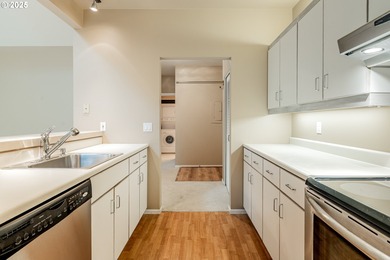 Perched on the top floor of a well-maintained building, this