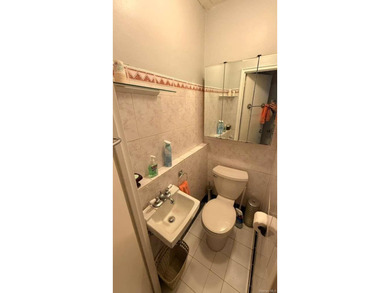 Charming 3-bedroom, 1.5-bath residence featuring a spacious - photo 5