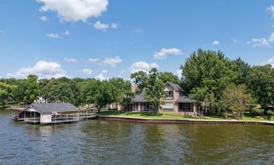 Set on a wide cove with open water views in the prestigious - Lake Home For Sale in Mabank, Texas