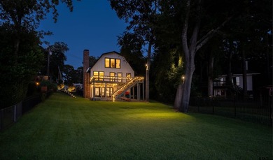 Main lake waterfront with private dock, updated interior, and - photo 1