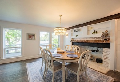 Main lake waterfront with private dock, updated interior, and - photo 7