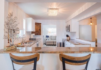 Main lake waterfront with private dock, updated interior, and - photo 8