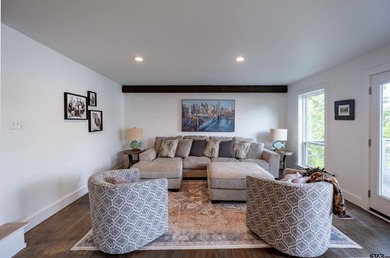 Main lake waterfront with private dock, updated interior, and - photo 9