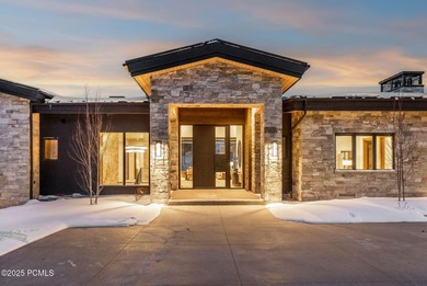 This newly completed estate sits on one of the premier homesites