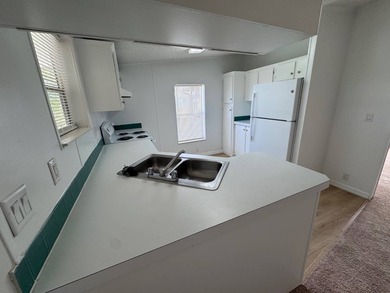 Welcome to this stunning two-bedroom, two-bath home that feels - photo 4
