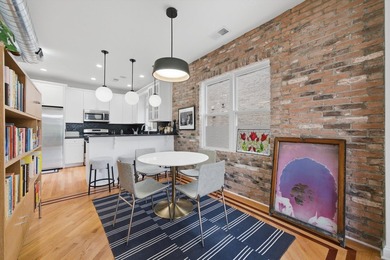 Stunning top-floor, three-bedroom, two-bathroom condo featuring - photo 9