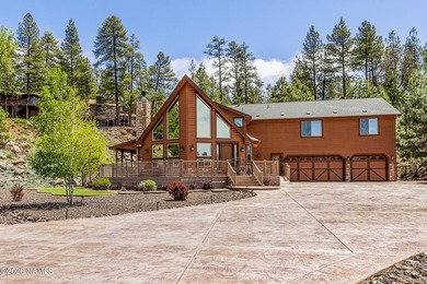 Nestled in a quiet cul-de-sac in Munds Park, this exceptional - photo 1
