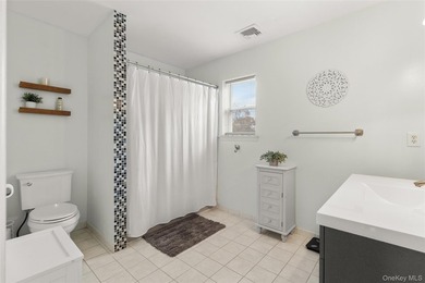 This beautifully renovated Colonial in East Islip sits on an - photo 14